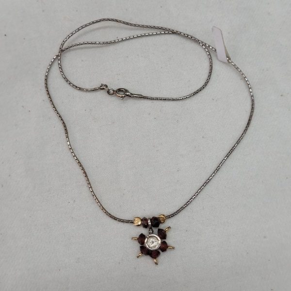 An original modern design of Garnets David star pendant made with Garnets beads, sterling silver and 14 carat gold beads with suitable chain.