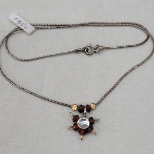 An original modern design of Garnets David star pendant made with Garnets beads, sterling silver and 14 carat gold beads with suitable chain.