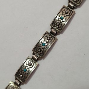 Handmade sterling silver Turquoises flowers bracelet on each silver bracelet link contemporary style with silver designed flower and Turquoises.