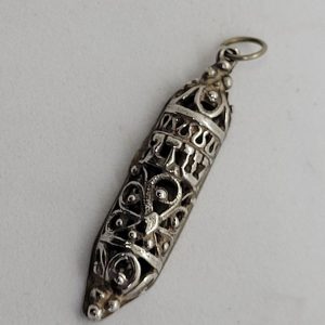 Handmade sterling silver Mezuzah pendant Yemenite Filigree with Shadai ( G-D) in Hebrew. Dimension 0.45 cm X 0.8 cm X 3.9 cm approximately.