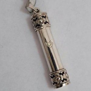Handmade sterling silver floral designs silver Mezuzah round pendant by S. Ghatan(Katan) with hand engraved Shin diameter 0.8 cm X 4.8 cm approximately.