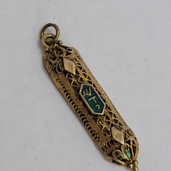 Handmade sterling silver gold plated Mezuzah pendant with blue enamel over raised letters Shaddai ( G-D) in Hebrew, 0.4 cm X 0.8 cm X 3.6 cm approximately.