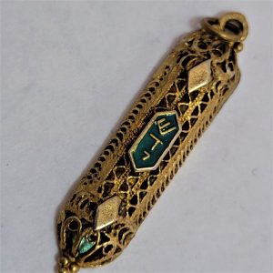 Handmade sterling silver gold plated Mezuzah pendant with blue enamel over raised letters Shaddai ( G-D) in Hebrew, 0.4 cm X 0.8 cm X 3.6 cm approximately.