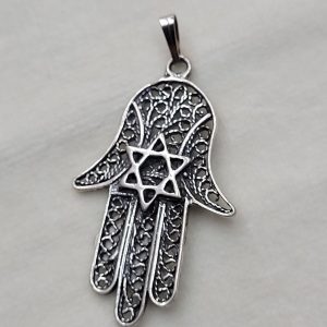 Handmade sterling silver Hamsa  pendant filigree MagenDavid and fine Yemenite filigree design. Dimension 2.5 cm X 4.5 cm X 0.1 cm approximately.