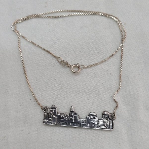 Handmade sterling silver Jerusalem skyline pendant with its houses and box chain. Dimension 3.8 cm X 1 cm X 0.1 cm approximately.