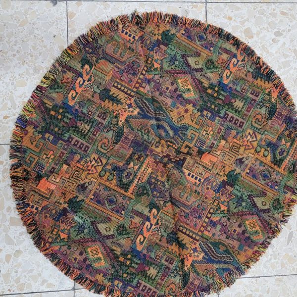 Handmade Druze round tablecloth orange, where each side is as beautiful because of the different shades of orange and yellow colors.