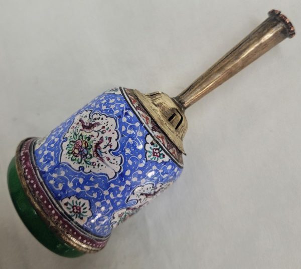 A combined handmade wood base and brass enameled Hanukah Dreidel hand painted floral & birds designs. Diameter diameter 4.2 cm X 12 cm approximately.