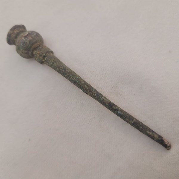 Genuine antique spin thread needle, where spinner had to attach thread at round bottom of needle so to keep on spinning, found in the holy land.