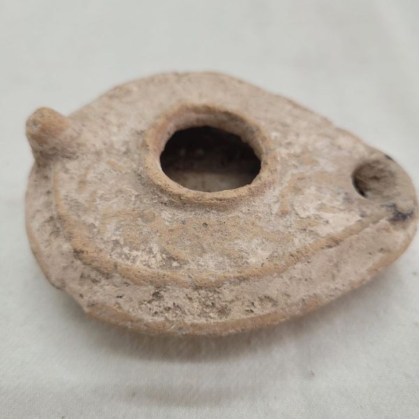 Genuine antique pottery oil lamp Roman era 1st century AD design décor defected a bit as due to the deep earth it was found.