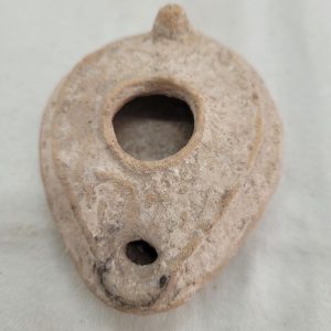 Genuine antique pottery oil lamp Roman era 1st century AD design décor defected a bit as due to the deep earth it was found.