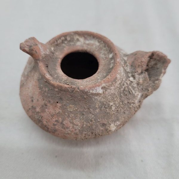 Genuine antique Roman oil lamp round Roman era in the holly land, as can be seen in photos, it has been damaged by age 7 cm X 4 cm X  6 cm.