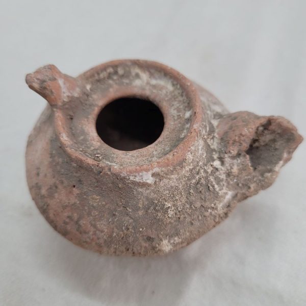 Genuine antique Roman oil lamp round Roman era in the holly land, as can be seen in photos, it has been damaged by age 7 cm X 4 cm X  6 cm.