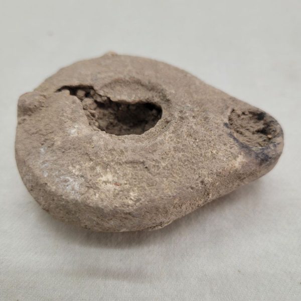 Genuine antique oil lamp pottery 3rd century BC with earth soaked in during ages. Dimension 5.5 cm X 2.8 cm X  7 cm approximately.