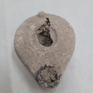 Genuine antique oil lamp pottery 3rd century BC with earth soaked in during ages. Dimension 5.5 cm X 2.8 cm X  7 cm approximately.