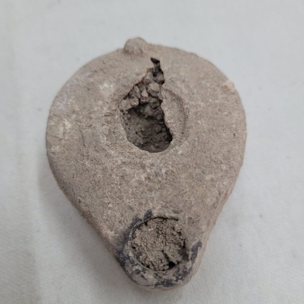 Genuine antique oil lamp pottery 3rd century BC with earth soaked in during ages. Dimension 5.5 cm X 2.8 cm X  7 cm approximately.