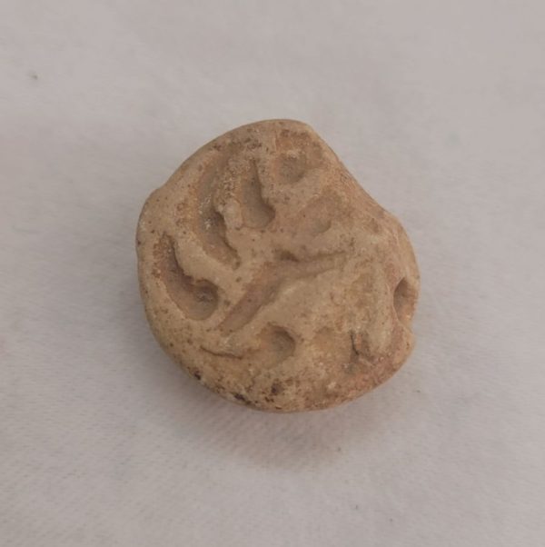 Antique pottery shard pendant made in the middle east 1st century B.C. used in the holly Jewish temple as a receipt paid for the offers given to the temple.