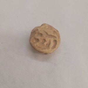 Antique pottery shard pendant made in the middle east 1st century B.C. used in the holly Jewish temple as a receipt paid for the offers given to the temple.