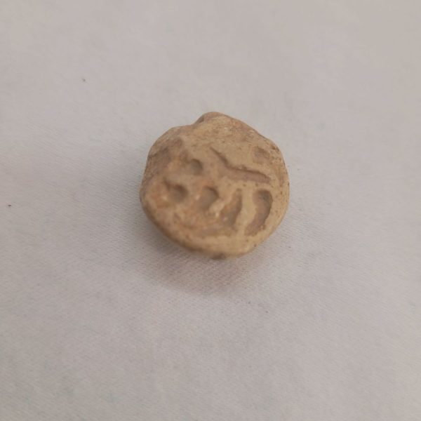 Antique pottery shard pendant made in the middle east 1st century B.C. used in the holly Jewish temple as a receipt paid for the offers given to the temple.
