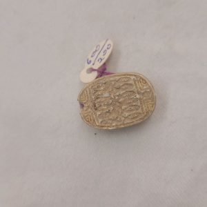 A genuine Egyptian Scarab cartouche with Hieroglyph writing mainly fish engravings dated 2nd century BC. Dimension 1.4 cm X 2.2 cm X 0.9 cm approximately.