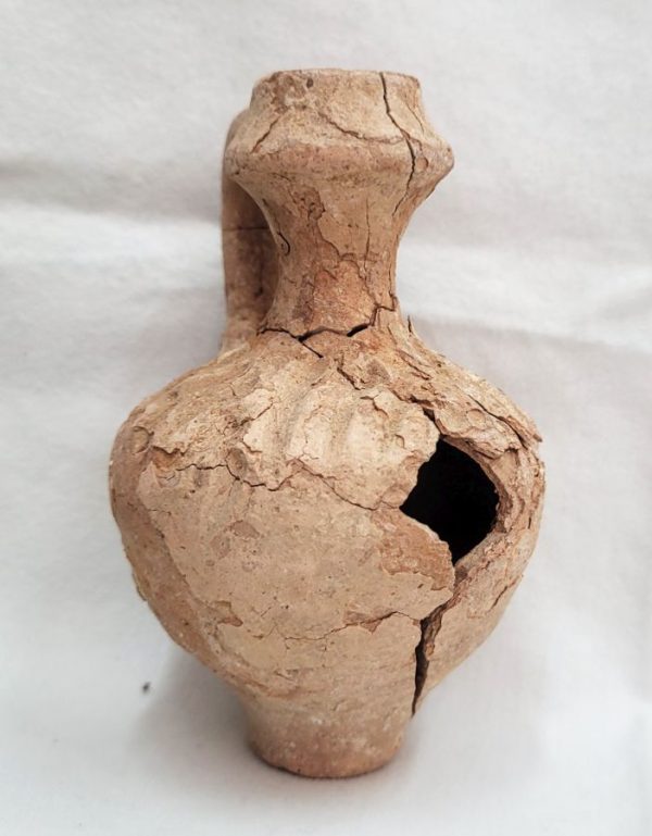 Antique broken pottery oil jar reconstructed, in those days one could use these kind of pottery jars to store wine , water or oil.