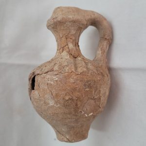 Antique broken pottery oil jar reconstructed, in those days one could use these kind of pottery jars to store wine , water or oil.