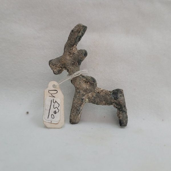 Genuine bronze deer idol antique has a loop on deer back to attach on a cord around neck but as generations of earth and corrosion, it looks like a hump.