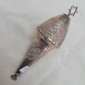The engravings on vintage brass and copper silver plated Raashan Purim ratchet Magen David are handmade & hammered showing floral and geometric designs.