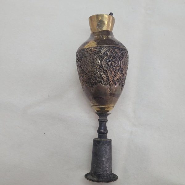 The engravings on vintage Purim Raashan Grogger brass are handmade & hammered brass showing different floral design and on top a brass bell.