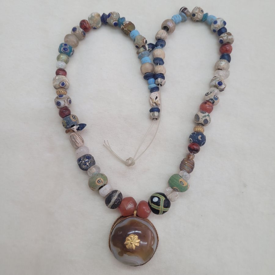 Hand made genuine antique stone beads necklace with Agate stone set in gold and also some blown glass beads and clay beads.