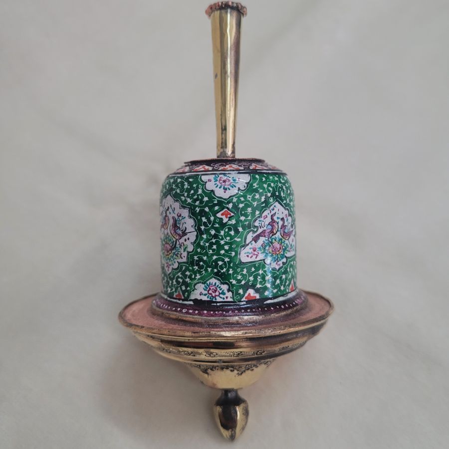 A combined handmade wood base and brass green enameled Hanukah Dreidel hand painted floral & birds designs diameter 5.6 cm X 12 cm.