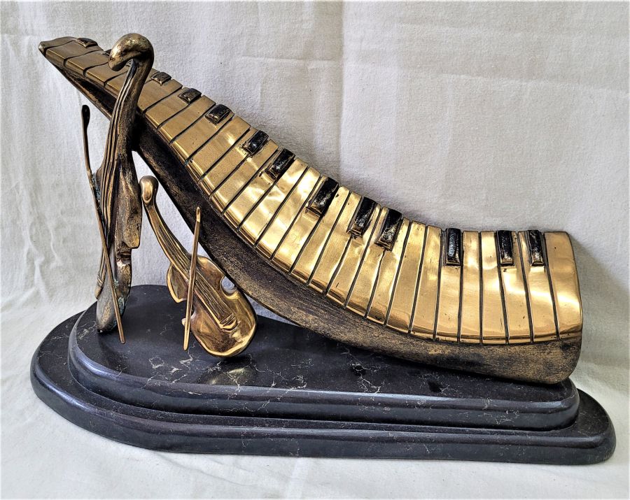Bronze cello piano violin sculpture is an original and one of a kind made by Y. Ethan. He never duplicate his art works 31 cm X 15 cm X 28 cm approximately.