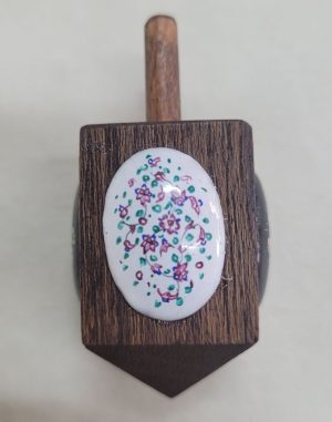 Handmade Hanukah Dreidel oval shape enameled with floral and birds designs on wood Dreidel. Dimension 3.7 cm X 3.7 cm X 7 cm approximately.