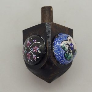 Handmade Hanukah Dreidel wood and enamel with floral designs. Made by S. Ghatan ( Katan). Dimension 3.3 cm X 4.8 cm X 3.3 cm approximately.