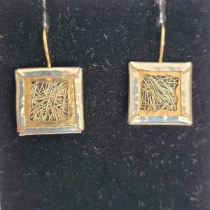 Sterling silver gold wires silver earrings, where the 14 carat gold wires are framed by a sterling silver frame. Dimension 5 cm X 1.3 cm approximately.
