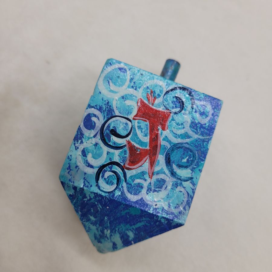 Hanukah Dreidel painted blue wood Sevivon hand painted with blue background and designs made by Weinstein from Jerusalem.