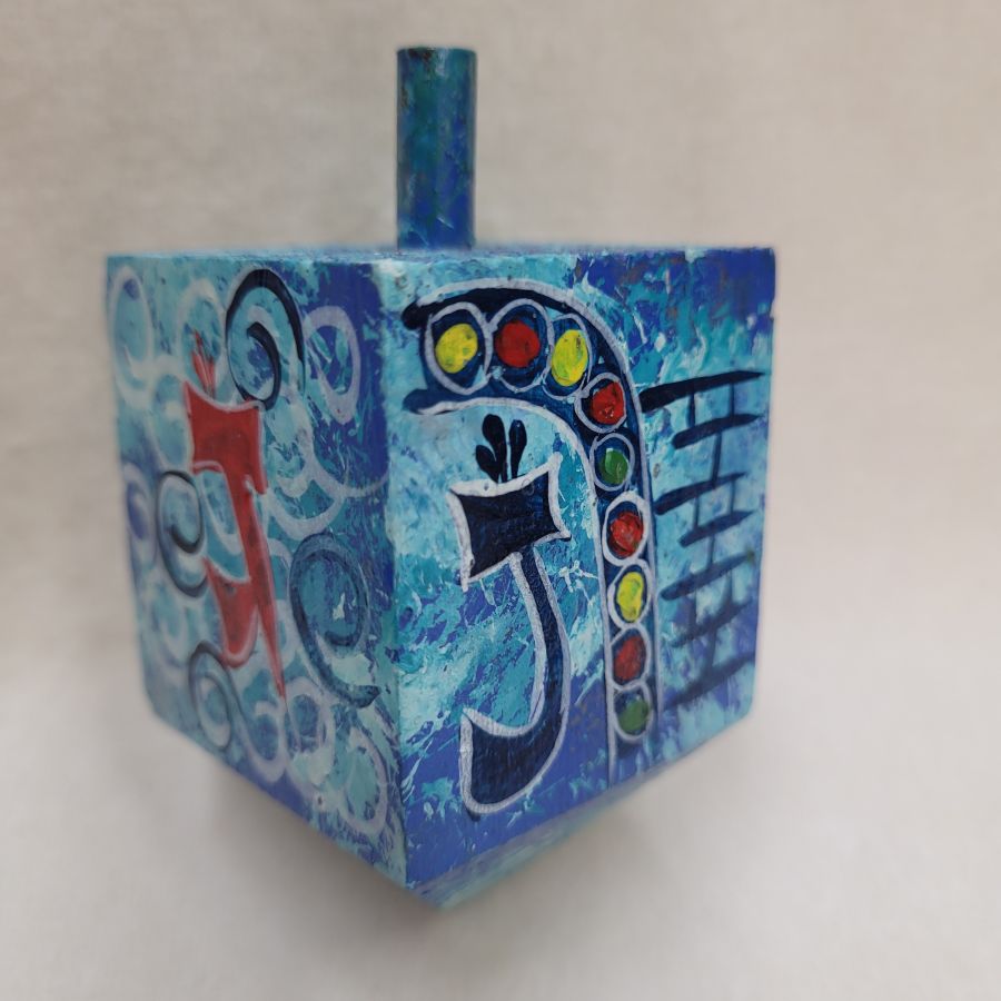 Hanukah Dreidel painted blue wood Sevivon hand painted with blue background and designs made by Weinstein from Jerusalem.