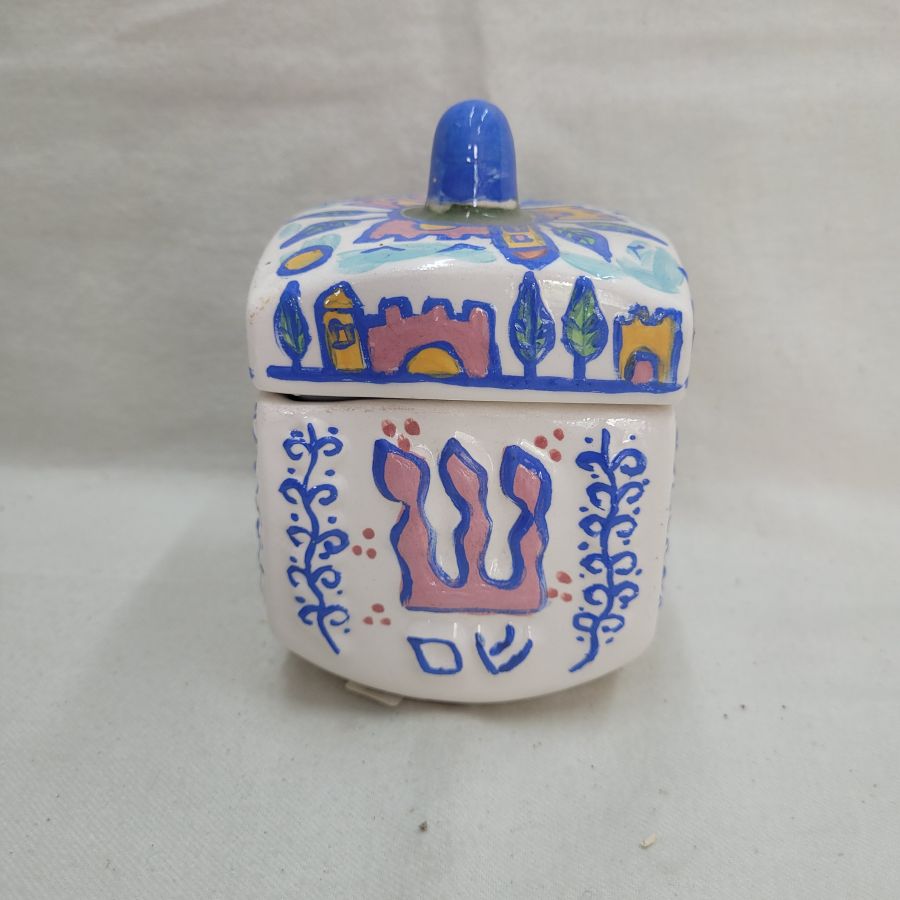 Hurwitz made this Dreidel shape box glazed where you can use to store sweets and chocolates. Dimension 7.5 cm X 7.5 cm X 10.5 cm approximately.