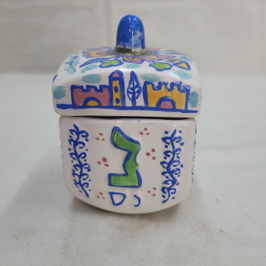 Hurwitz made this Dreidel shape box glazed where you can use to store sweets and chocolates. Dimension 7.5 cm X 7.5 cm X 10.5 cm approximately.