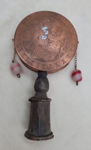 Purim Grogger copper vintage handmade with engravings and beads. The noise is made once one swings the handle swiftly so the beads knock the metal.Â