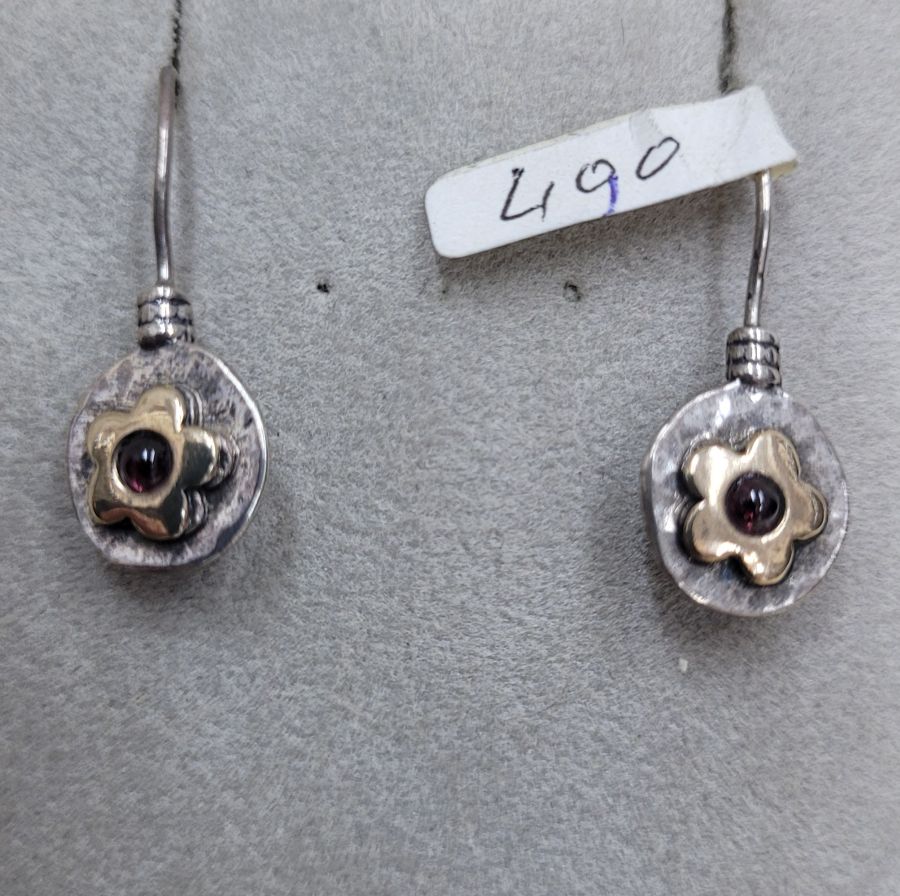 The hook in sterling silver and 14 carat gold flower Garnet earrings can not be changed to screw finding for non pierced ears.