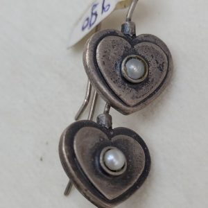 Handmade sterling silver heart shape earrings set with white round genuine pearl in center of heart. Dimension 1.6 cm X 1.2 cm approximately.