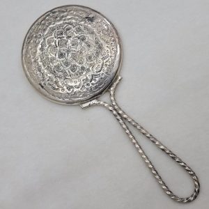 Handmade vintage copper silver plated lady's hand bag mirror set with hand hammered floral design made in the 1960's, 12 cm X diameter 6 cm approximately.