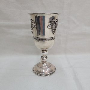 Sterling Silver Relief grapes Kiddush cup with 3 grapes designs, and filigree wires around borders. Dimension diameter 7 cm X 13.2 cm approximately.