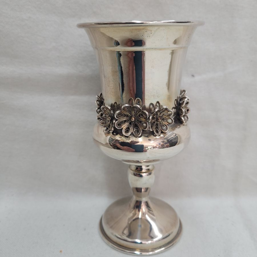 Handmade sterling silver Kiddush chalice Yemenite filigree flowers designs around. Dimension diameter 7.2 cm X 14 cm approximately.