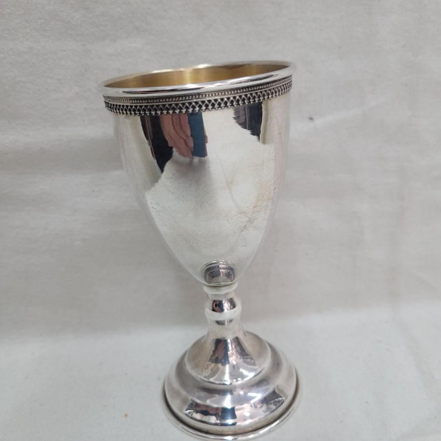 Sterling Silver Kiddush wine grapes chalice with delicate Yemenite filigree designs around cup border. Dimension diameter 6.5 cm X 13.3 cm approximately.