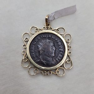 Handmade 14 carat gold wires framing pendant set Roman coin 5th century found in Israel. Dimension 2.7 cm X 0.25 cm X 2.7 cm approximately.