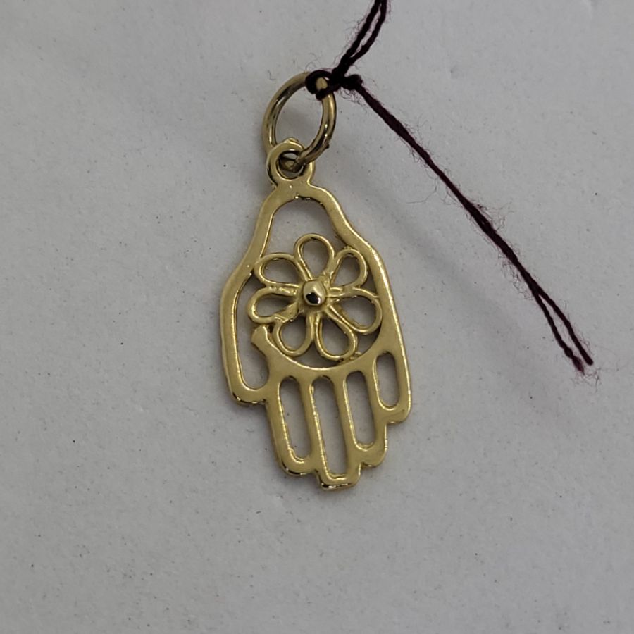Handmade 14 Carat gold cut out Hamsa Chamsa pendant with twisted flower shape in center. Dimension 1.2 cm X 2.7 cm X 0.15 approximately.